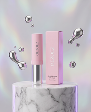 OEZOEZ Glaze Bloom Oil Balm on marble podium